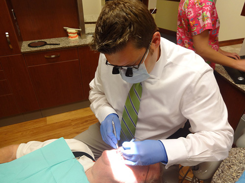 Dr. Kenneth R. Eye II, an expert in cosmetic dentistry in Harrisonburg, works on an actual patient.
